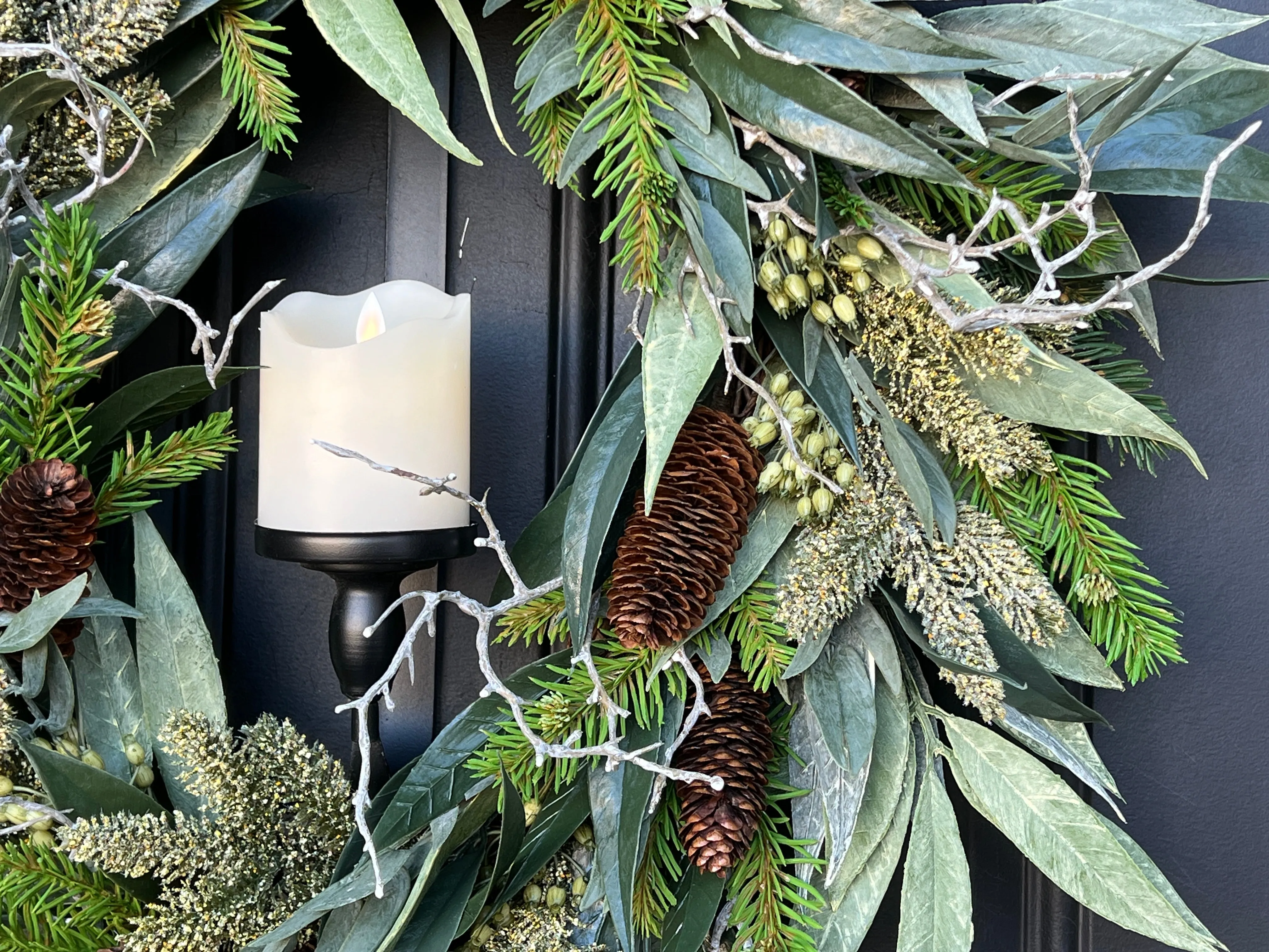 A Christmas Gathering Winter Wreath with Flickering Candle